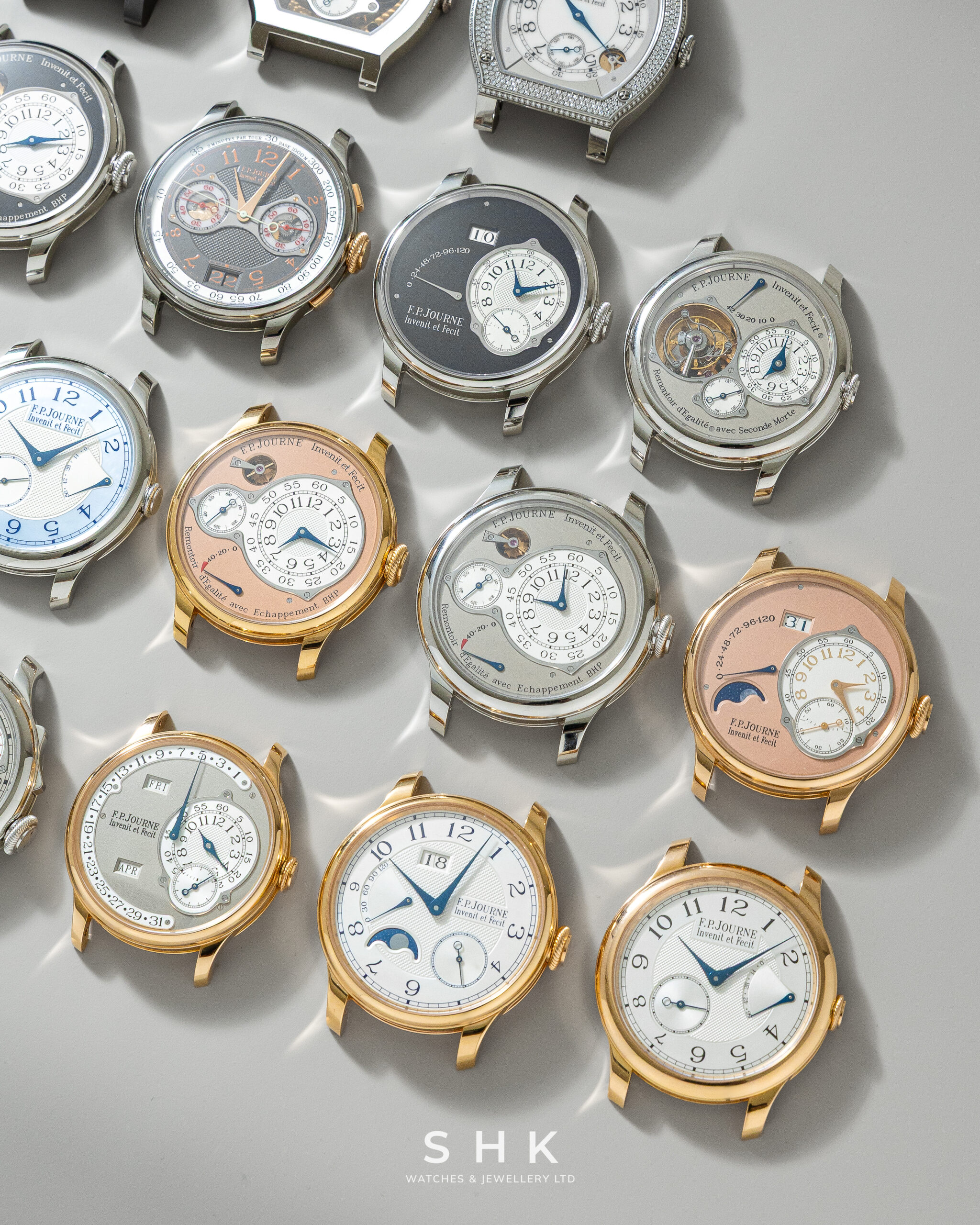 F.P. Journe Chronographe FB Tokyo, Tourbillon Souverain Vertical and Octa watches arranged on a grey surface